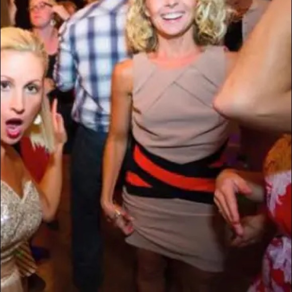 Tan bandage dress with bright orange and black waist detailing. - Picture 2 of 7